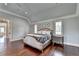 Spacious main bedroom with hardwood floors, vaulted ceilings, plantation shutters, and walk-in closet at 4745 Cuyahoga Cv, Suwanee, GA 30024