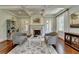 Charming office with fireplace, hardwood floors, and a decorative rug at 4745 Cuyahoga Cv, Suwanee, GA 30024