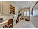 Well-organized office space with built-in storage, countertops, and a window for natural light at 4745 Cuyahoga Cv, Suwanee, GA 30024