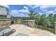 Stunning stone patio offers peaceful lake views, perfect for outdoor relaxation at 4745 Cuyahoga Cv, Suwanee, GA 30024
