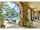 Outdoor pool area with stone arches, lounge chairs, and manicured landscaping at 4745 Cuyahoga Cv, Suwanee, GA 30024