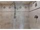 Elegant tiled shower features detailed fixtures and neutral color palette at 4745 Cuyahoga Cv, Suwanee, GA 30024