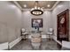 Cozy wine-tasting room featuring a barrel table, unique lighting, and seating for intimate gatherings at 4745 Cuyahoga Cv, Suwanee, GA 30024