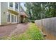 Fenced backyard with wooden deck and outdoor access at 2108 Yorkshire Ct, Woodstock, GA 30189