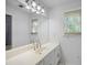 Bright bathroom with white vanity, large mirror, and modern fixtures at 2108 Yorkshire Ct, Woodstock, GA 30189