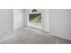 Bedroom boasts large windows and plush carpeting at 2108 Yorkshire Ct, Woodstock, GA 30189