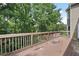 Spacious wooden deck overlooking a lush, wooded backyard at 2108 Yorkshire Ct, Woodstock, GA 30189
