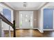 Inviting foyer with hardwood floors, decorative door, and beautiful trim details at 2108 Yorkshire Ct, Woodstock, GA 30189