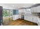 Spacious kitchen featuring stainless steel appliances, white cabinets, and stone countertops at 2108 Yorkshire Ct, Woodstock, GA 30189