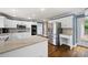 Well-lit kitchen featuring stainless steel appliances, granite counters, and an eat-in island at 2108 Yorkshire Ct, Woodstock, GA 30189