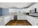 Modern kitchen with white cabinets, stainless steel appliances, and granite countertops at 2108 Yorkshire Ct, Woodstock, GA 30189