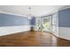 Bright living room with hardwood floors, bay window, and stylish chandelier lighting at 2108 Yorkshire Ct, Woodstock, GA 30189