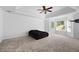 Large main bedroom has tray ceilings, large windows, and carpet at 2108 Yorkshire Ct, Woodstock, GA 30189