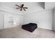 Main bedroom with carpet, ceiling fan, and entry to main bath at 2108 Yorkshire Ct, Woodstock, GA 30189