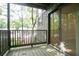 Charming wooden balcony with sliding glass door overlooks lush greenery at 408 River Run Dr, Sandy Springs, GA 30350
