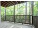 Wooden balcony surrounded by serene wooded views at 408 River Run Dr, Sandy Springs, GA 30350