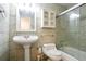 Bathroom with a glass shower, pedestal sink and medicine cabinet at 408 River Run Dr, Sandy Springs, GA 30350