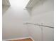 Walk-in closet with wood floors and metal racks for storage at 408 River Run Dr, Sandy Springs, GA 30350