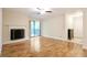 Well-lit living room with a fireplace, balcony entrance, and a spacious feel for modern living at 408 River Run Dr, Sandy Springs, GA 30350