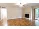 Inviting living room featuring wood floors, a fireplace, and a sliding glass door to the balcony at 408 River Run Dr, Sandy Springs, GA 30350