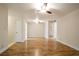 Open living area with wood flooring, neutral walls, and ceiling fan, ready for personalization at 408 River Run Dr, Sandy Springs, GA 30350