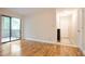 Living room with wood floors, neutral walls, and access to a balcony at 408 River Run Dr, Sandy Springs, GA 30350
