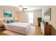 Bright main bedroom featuring wood floors, neutral walls, and a ceiling fan at 408 River Run Dr, Sandy Springs, GA 30350