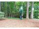 Convenient pet waste station in a wooded walking area at 408 River Run Dr, Sandy Springs, GA 30350