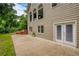 Exterior view showing a patio area with double doors and a large concrete slab at 610 Woodstream Ct, Roswell, GA 30075