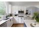 Well-lit kitchen with a modern sink, stainless steel appliances, and marble countertops at 610 Woodstream Ct, Roswell, GA 30075