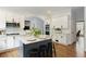 Bright kitchen with modern appliances, an island, and stylish white cabinetry at 610 Woodstream Ct, Roswell, GA 30075