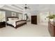 Spacious main bedroom with tray ceilings, lots of natural light, and an attached bathroom at 610 Woodstream Ct, Roswell, GA 30075
