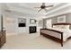 Comfortable main bedroom with a fireplace and built in cabinets, providing ample storage space at 610 Woodstream Ct, Roswell, GA 30075