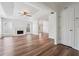 Bright living room with white walls, wood floors, fireplace and lots of natural light at 645 Ruxbury Ct, Suwanee, GA 30024