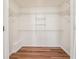 Spacious walk-in closet with ample shelving, providing generous storage solutions at 645 Ruxbury Ct, Suwanee, GA 30024