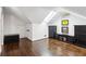 Attic with hardwood floors, skylight, and dark wood storage furniture at 16 Walker Ne Ter, Atlanta, GA 30309