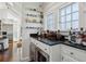 Bright bar area featuring black countertops and many windows at 16 Walker Ne Ter, Atlanta, GA 30309