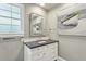Elegant bathroom features a white vanity cabinet with a gray countertop, and modern fixtures at 16 Walker Ne Ter, Atlanta, GA 30309