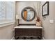 Stylish powder room with a decorative mirror, unique vanity, and elegant finishes at 16 Walker Ne Ter, Atlanta, GA 30309