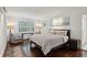 Inviting bedroom with a king-size bed, dark wood floors, and natural light at 16 Walker Ne Ter, Atlanta, GA 30309