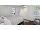 Spacious bedroom features natural light, dark hardwood flooring, and comfortable seating at 16 Walker Ne Ter, Atlanta, GA 30309