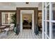 Elegant foyer featuring brick walls, tiled flooring, and an open view into the living room at 16 Walker Ne Ter, Atlanta, GA 30309