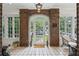 Elegant foyer featuring brick walls, tiled flooring, and front door leading to the outdoors at 16 Walker Ne Ter, Atlanta, GA 30309