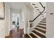 Staircase leading to the upper level showcasing wood flooring and white trim at 16 Walker Ne Ter, Atlanta, GA 30309