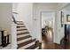 Hallway with wood flooring, white trim and stairs leading to the upper level at 16 Walker Ne Ter, Atlanta, GA 30309