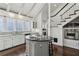 Bright kitchen featuring white cabinets, stainless steel appliances, island and sky lights at 16 Walker Ne Ter, Atlanta, GA 30309