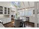 Bright kitchen featuring white cabinets, stainless steel appliances, island and sky lights at 16 Walker Ne Ter, Atlanta, GA 30309