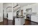 Bright kitchen featuring white cabinets, stainless steel appliances and dark countertops at 16 Walker Ne Ter, Atlanta, GA 30309