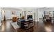 Open-concept living room with fireplace, hardwood floors, and elegant furnishings at 16 Walker Ne Ter, Atlanta, GA 30309