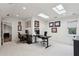 Office space with skylights, white carpet, and two black work stations at 16 Walker Ne Ter, Atlanta, GA 30309